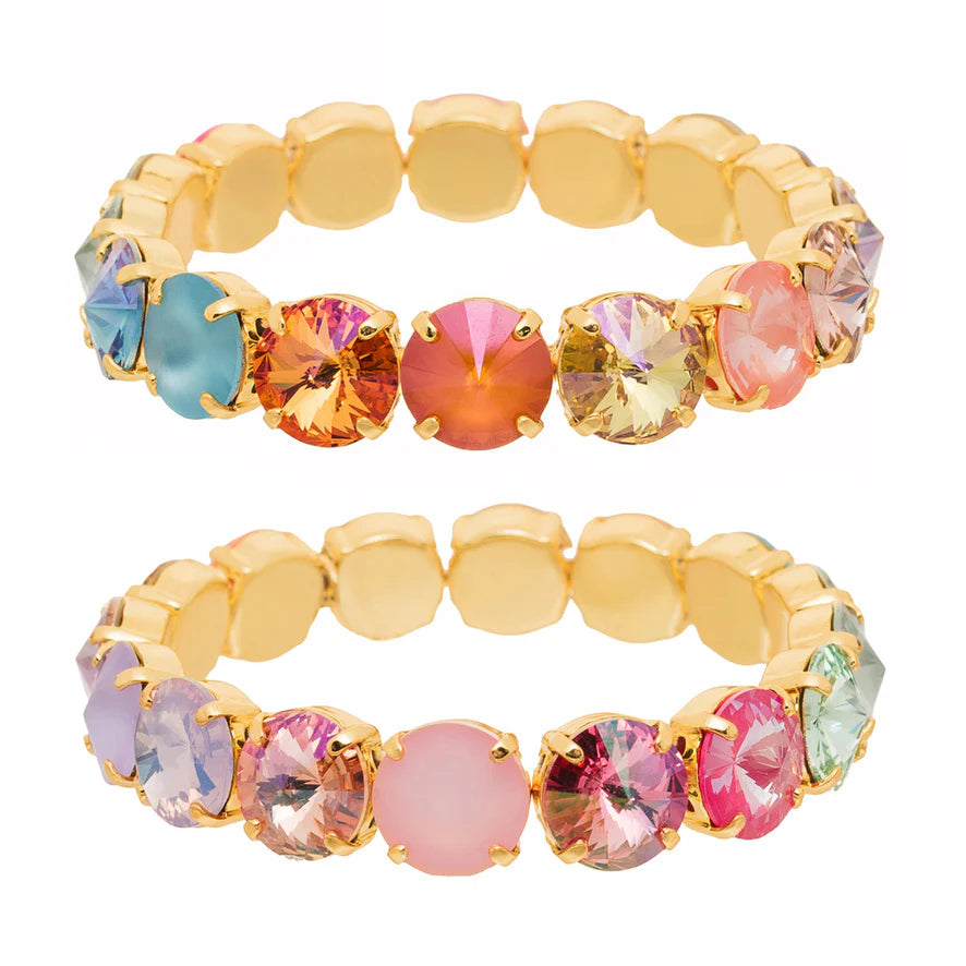Multicolored gemstone bracelet with gold accents on a white background