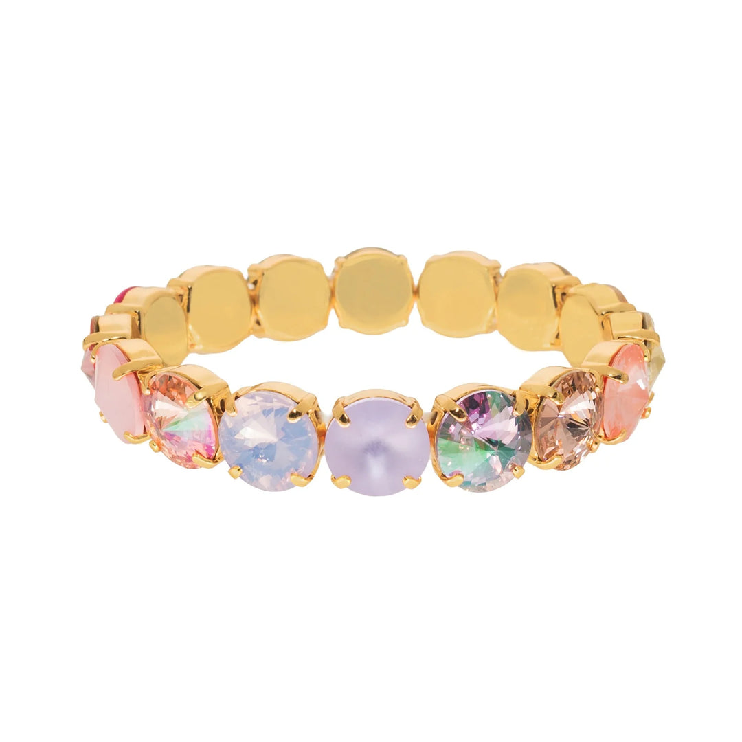 Gold bracelet with multicolored gemstones on a white background