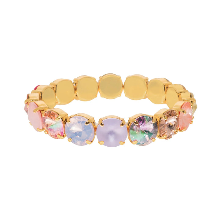 Gold bracelet with multicolored gemstones on a white background