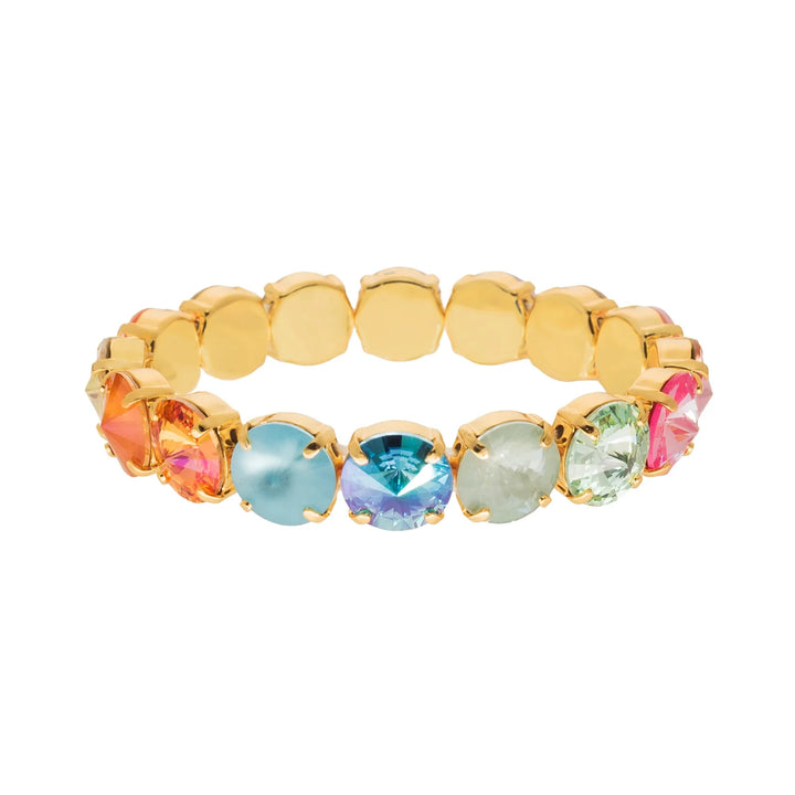 Gold ring with colorful gemstones on a white background