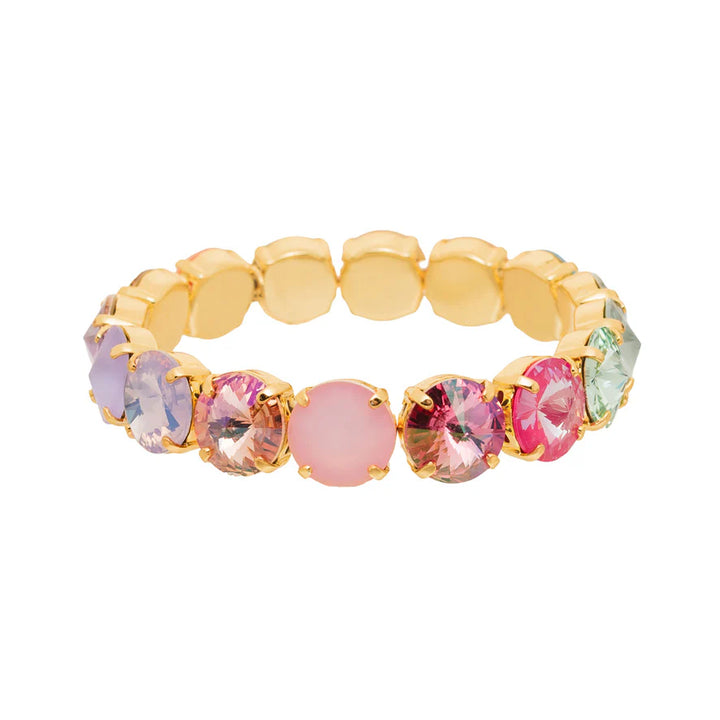 Gold bracelet with colorful gemstones on a white background