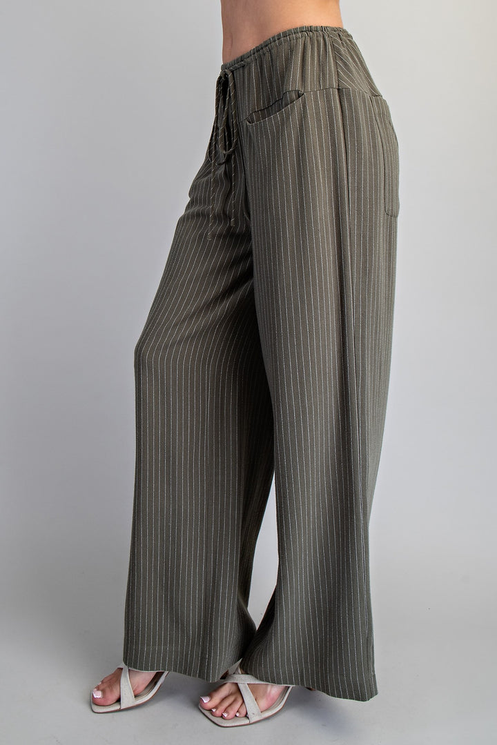 Striped wide-leg pants on a plain background