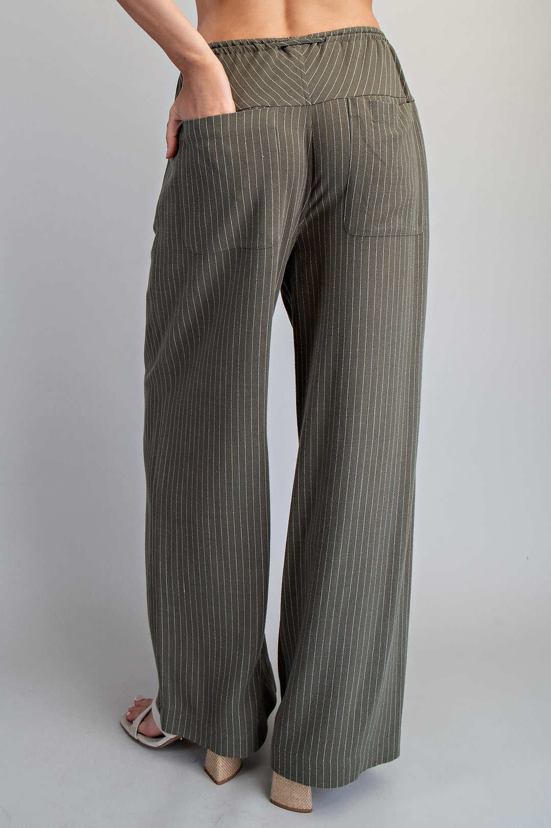 Striped wide-leg pants worn by a person on a plain background