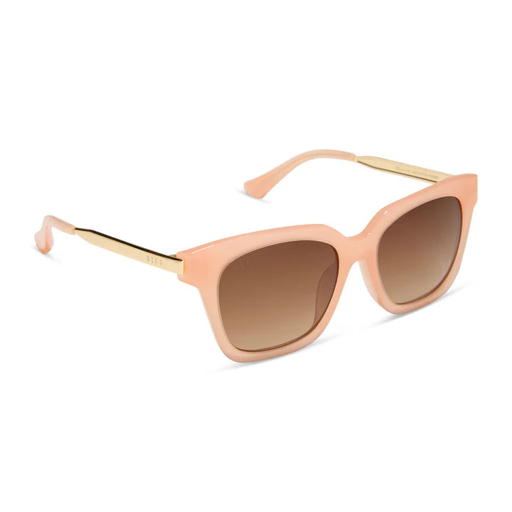 Pair of peach and gold sunglasses with brown gradient lenses on white background