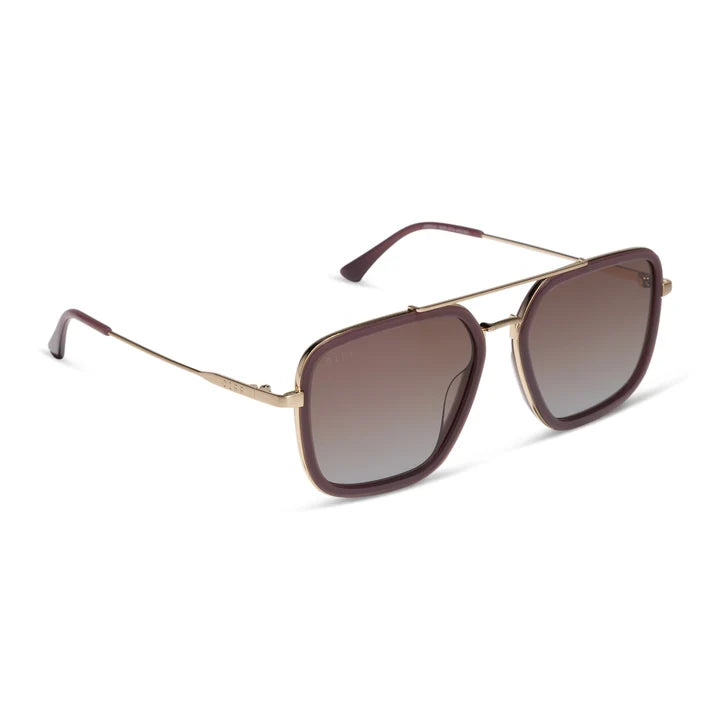 Sunglasses with gold frame and brown gradient lenses on a white background