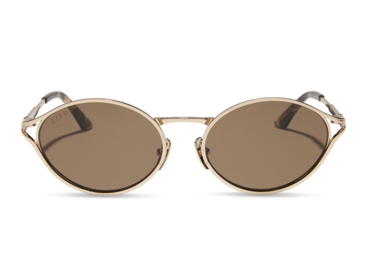 Pair of gold sunglasses with brown lenses on white background