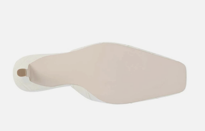 A single beige insole or shoe insert shown from the top on a plain light gray background.
