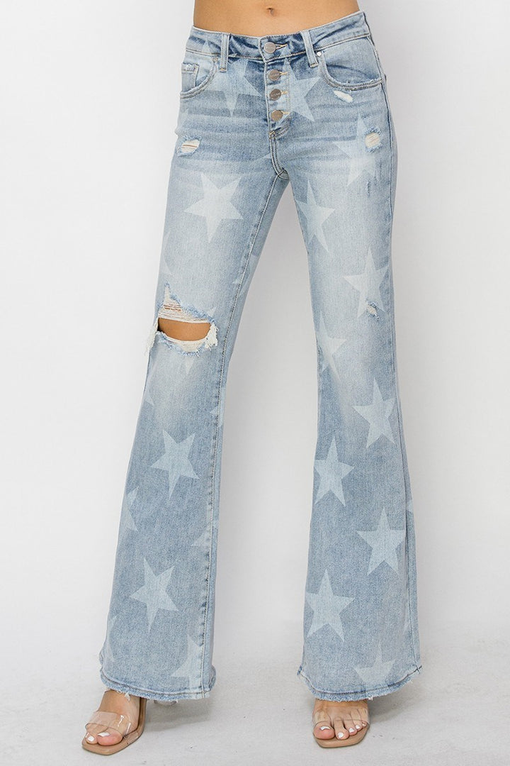 Light blue jeans with star patterns on a white background