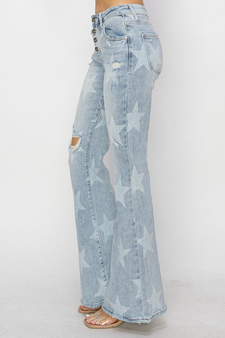 Light blue flared jeans with star pattern on a white background