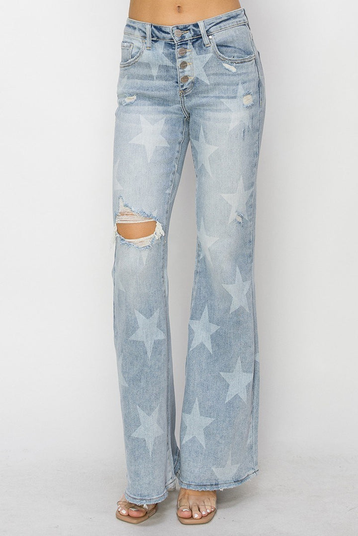 Light blue jeans with star patterns on a white background