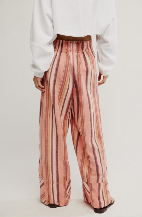 Woman wearing stripe pants on white background