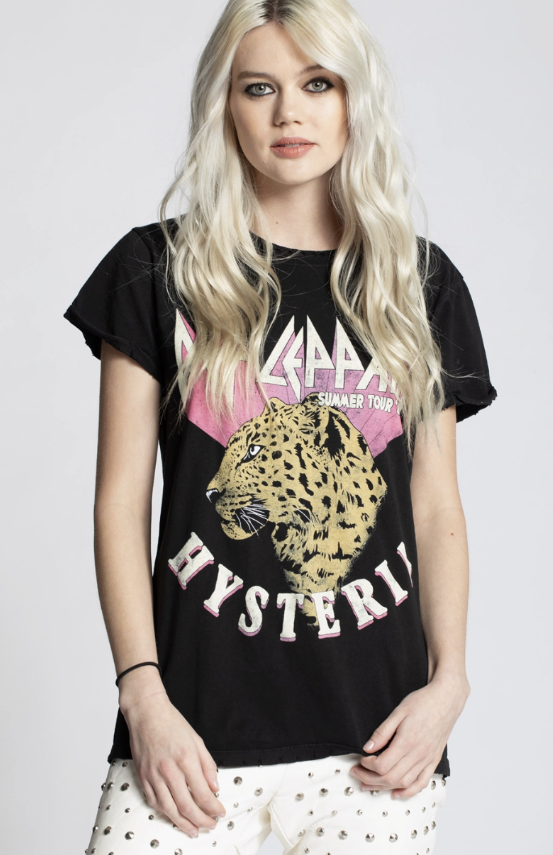 Woman wearing a black t-shirt with a leopard graphic and 'Mystery' text on a white background