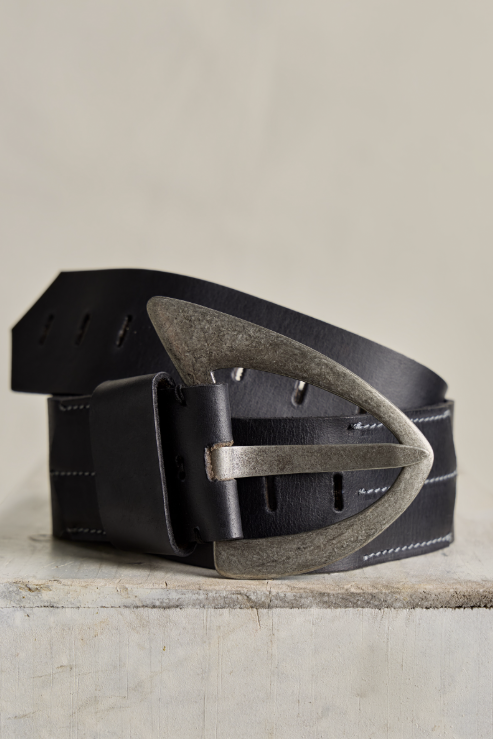 Black leather belt with a metallic buckle on a light wooden surface.