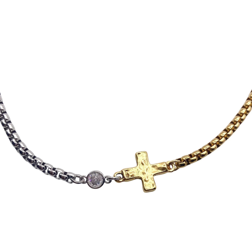 Necklace with a gold cross pendant on a white background