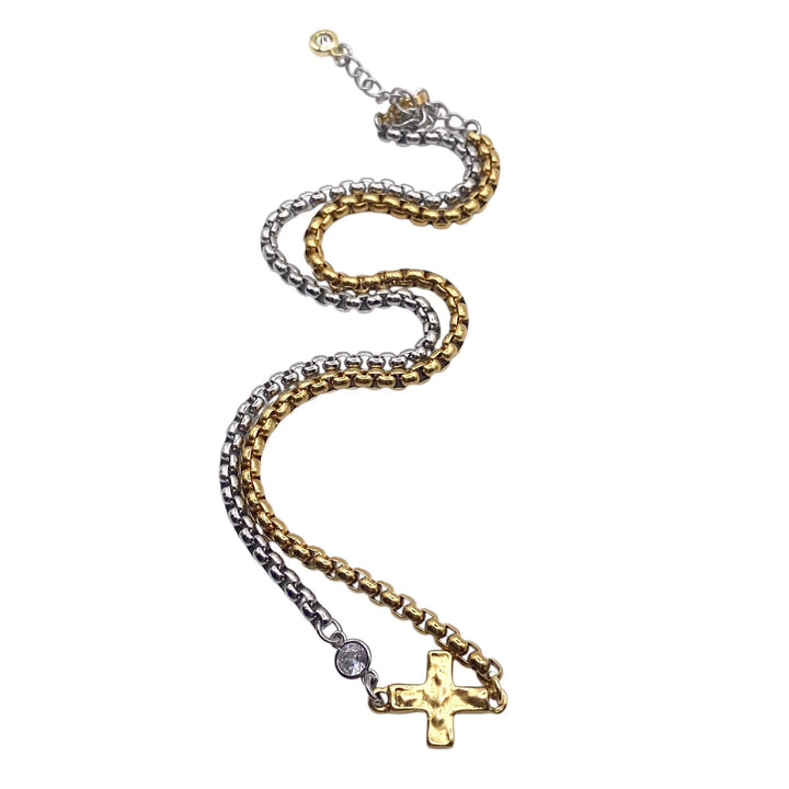 Two-tone chain necklace with a cross pendant on a white background