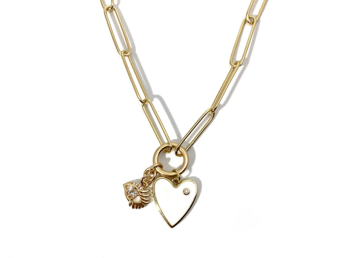 Gold necklace with heart-shaped pendant on a white background