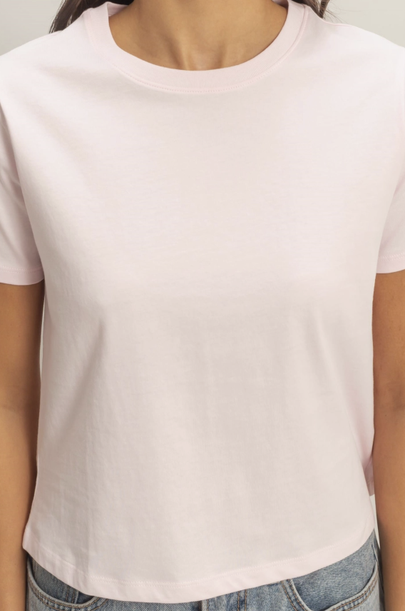 Person wearing a plain white t-shirt and jeans