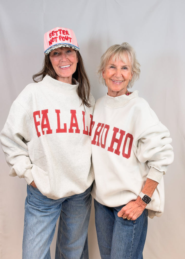 Two women wearing grey mockeck neck with &