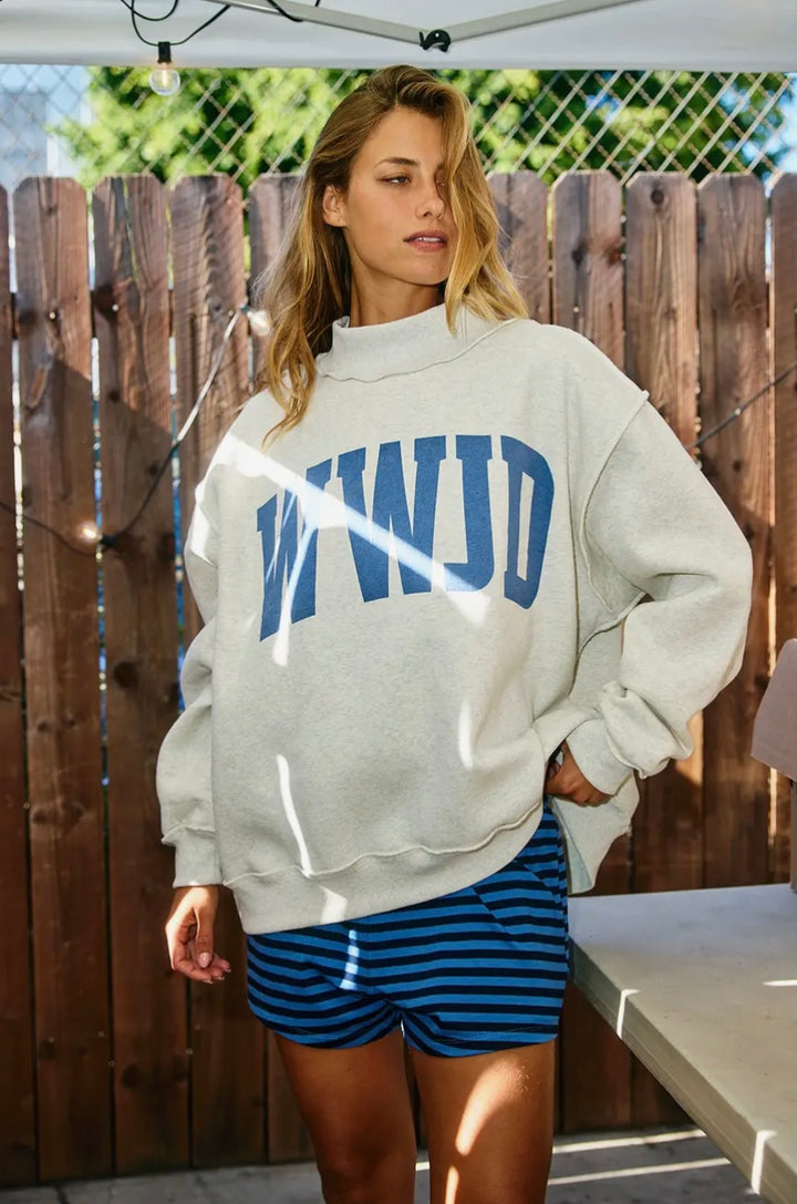 Woman wearing grey sweatshirt saying WWJD and striped shorts