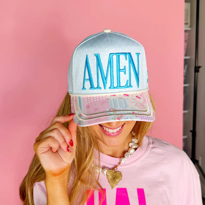 Woman wearing hat with &