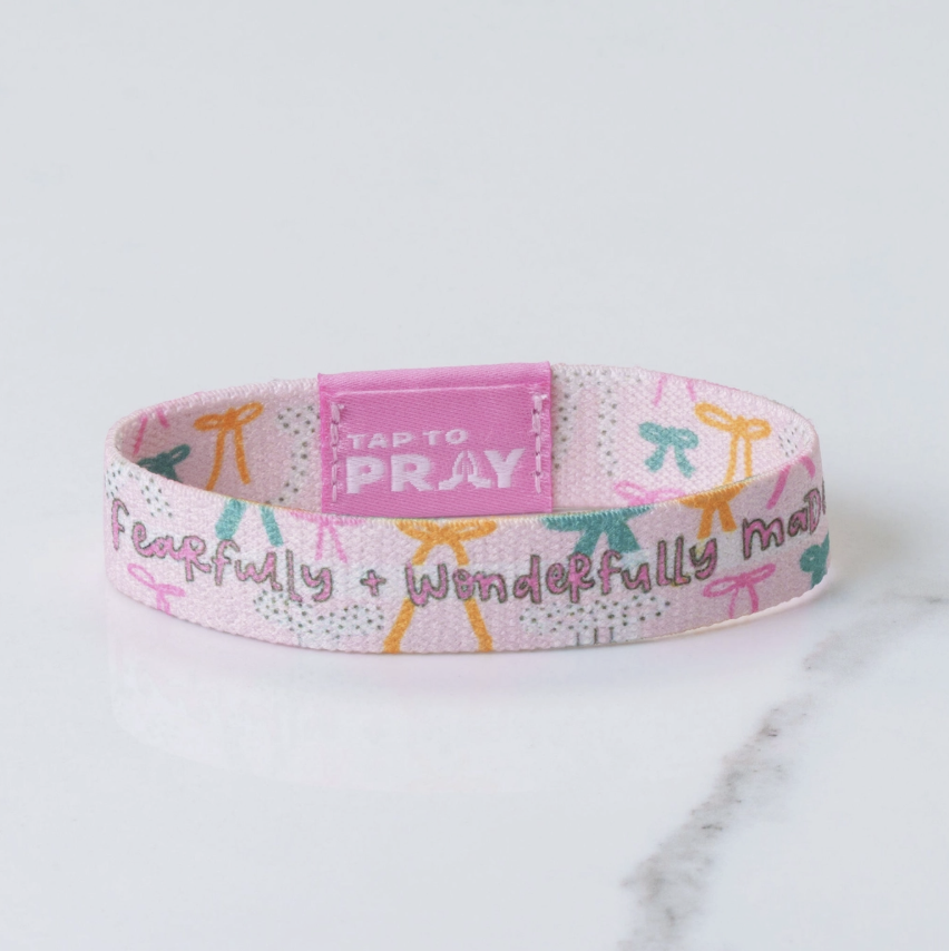 Wristband with motivational text on a marble surface