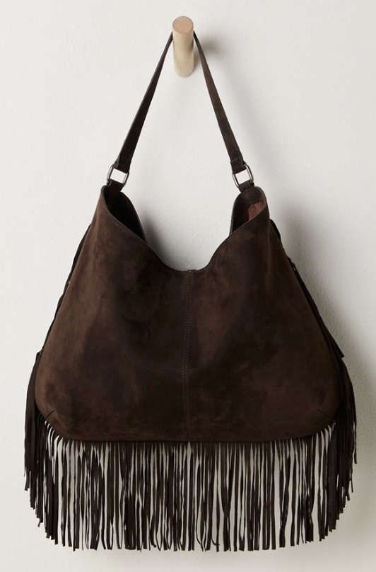 Brown suede handbag with fringes on a white background