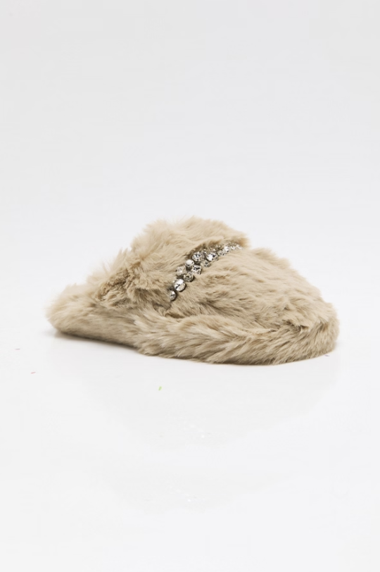 A single beige faux fur slip-on mule shoe decorated with a silver rhinestone embellishment across the top, set against a plain white background.