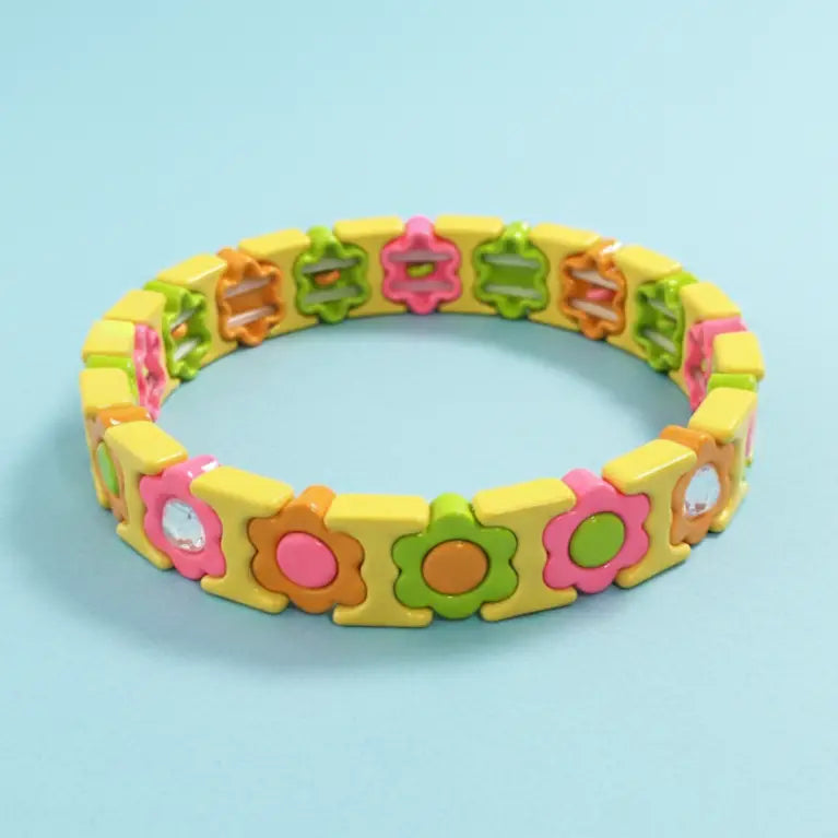 Colorful bracelet with floral designs on a light blue background