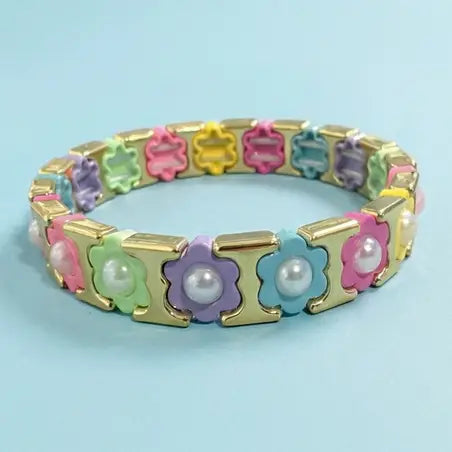 Colorful bracelet with floral designs on a light blue background