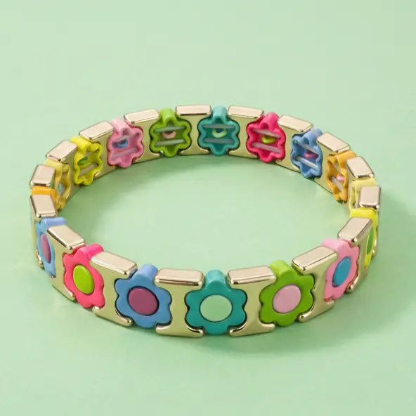 Colorful bracelet with floral designs on a light green background