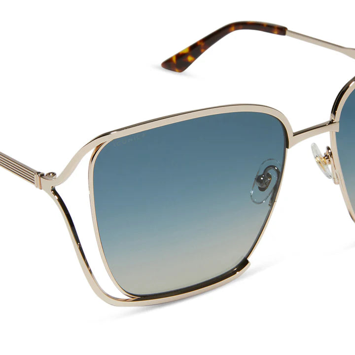 Gold-framed sunglasses with blue gradient lenses on a white background