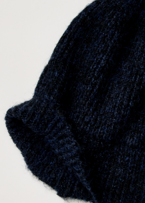 Dark blue knit beanie shown on plain background