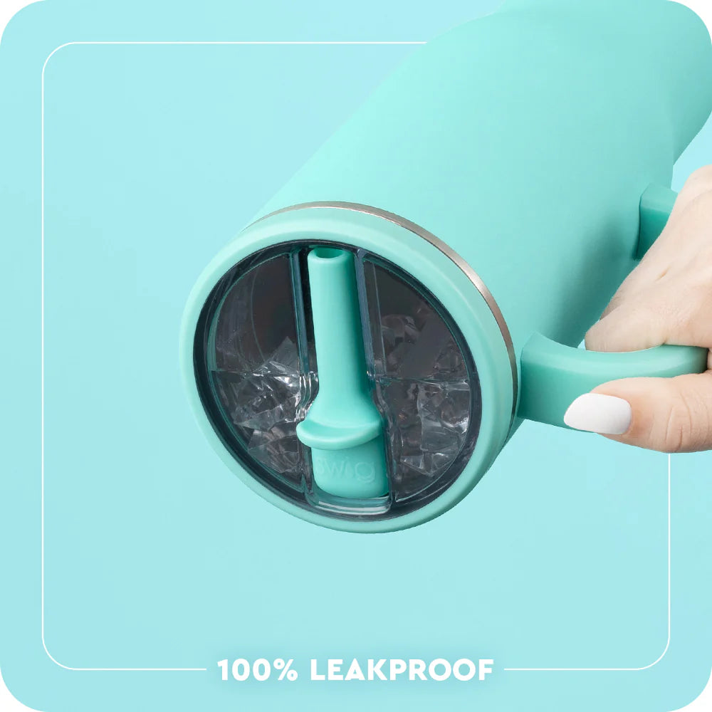 Turquoise ice cream maker with a hand holding it, labeled &
