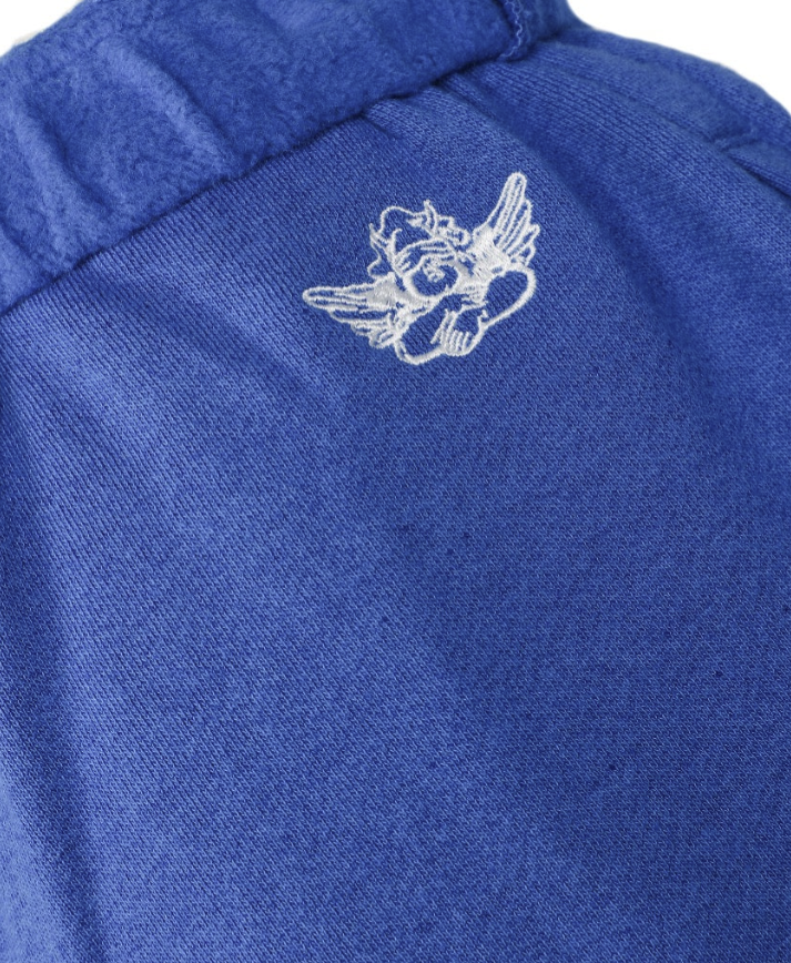 Close-up of a blue shorts with a white logo on the top