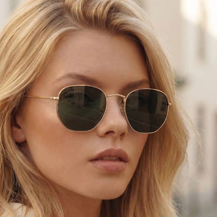 woman wearing metal frame sunglasses with black lens