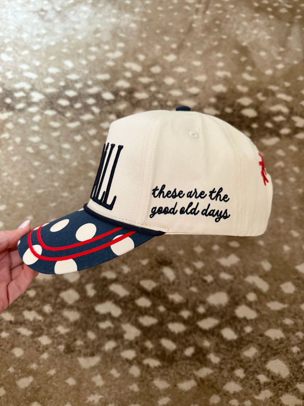 Trucker hat with 'these are the good old days' on side on pattern background