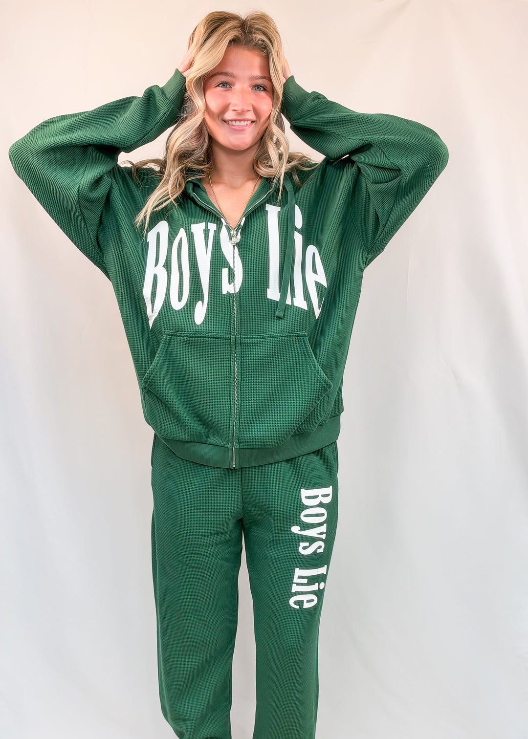 Woman wearing matching green set with &