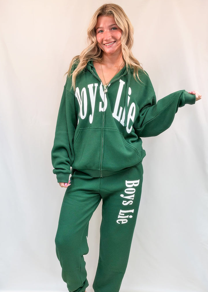 Woman wearing matching green set with &