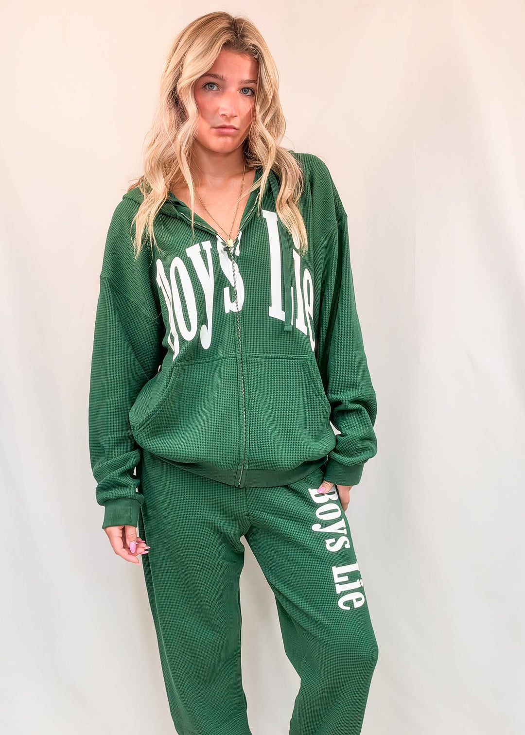 Woman wearing matching green set with &