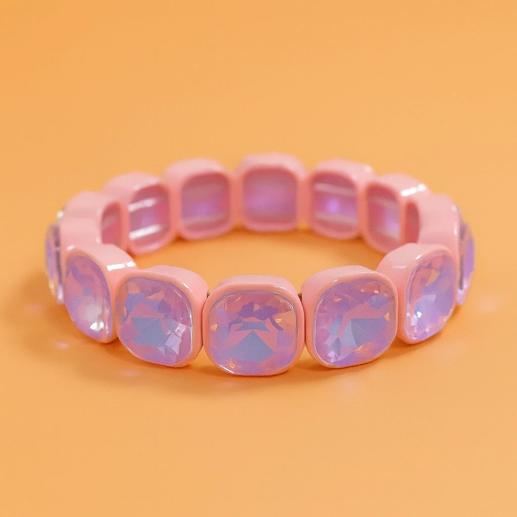 Pink bracelet with square-shaped beads on an orange background