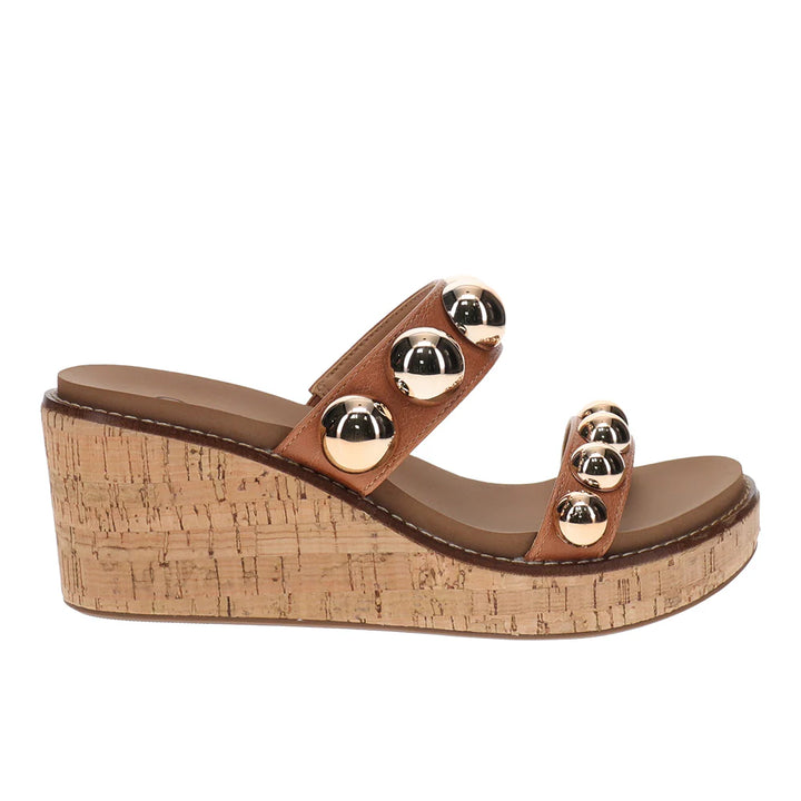brown wedge with golden studs with cork heel on white background