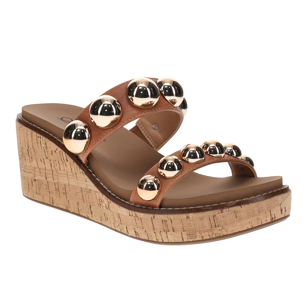 brown sandal with gold studs and cork heel on white background