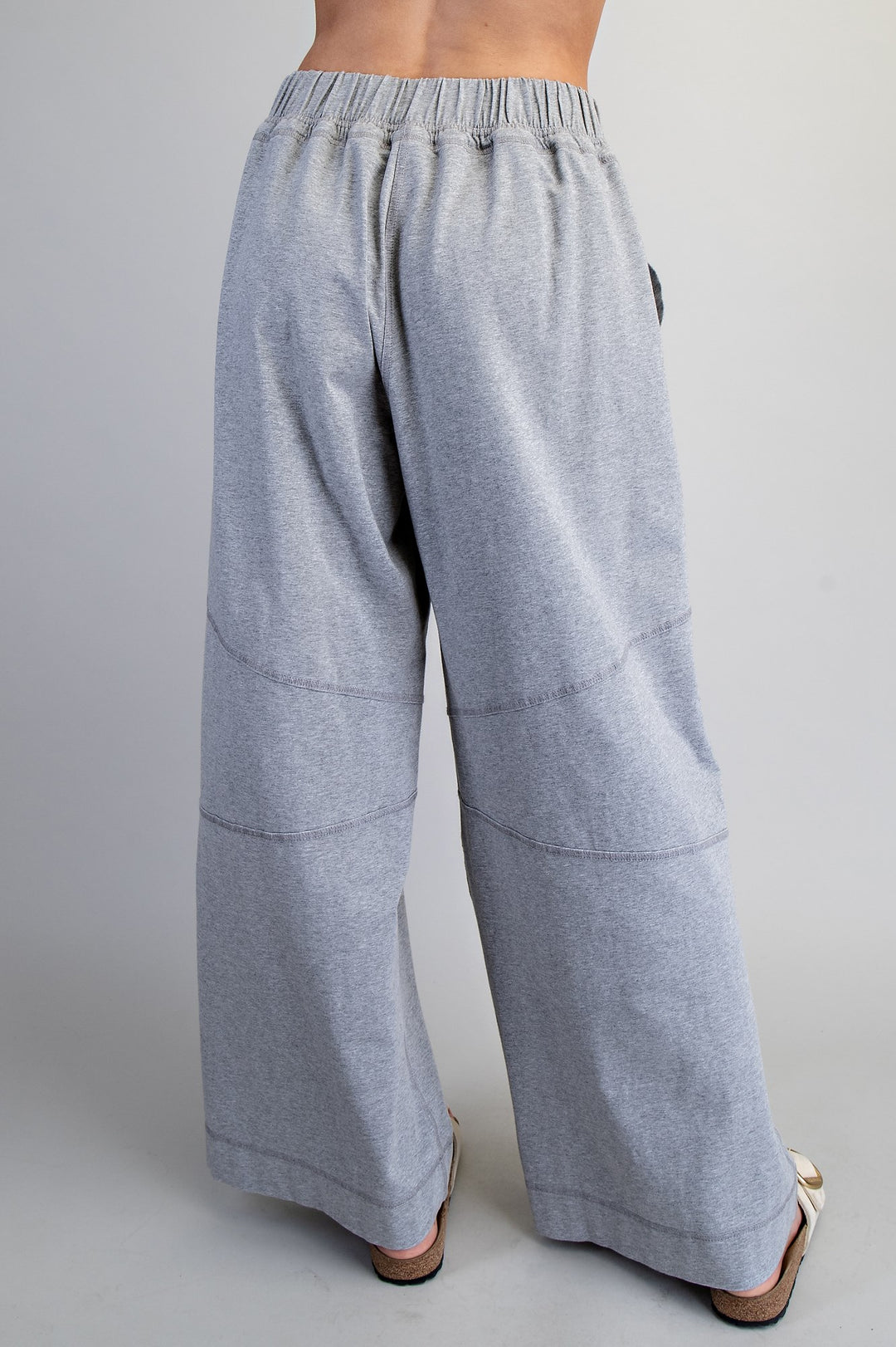 Gray wide-leg pants on a plain background