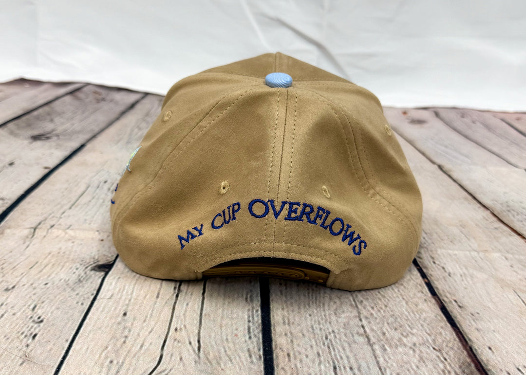 Back of brown trucker hat with &