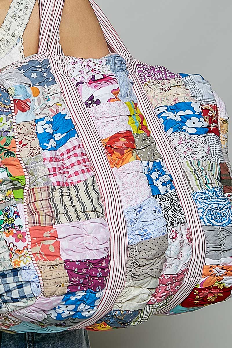 quilted bag on plain background