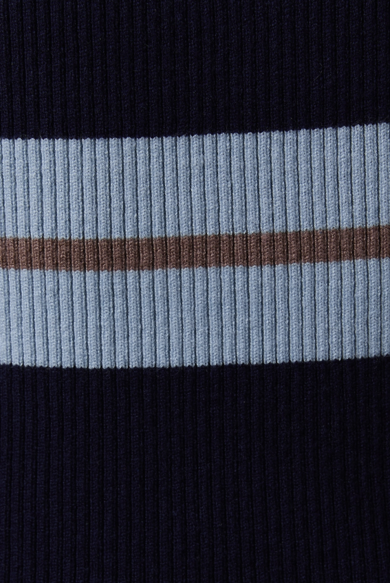 Close-up of a sweater with black, blue, and brown horizontal stripes.