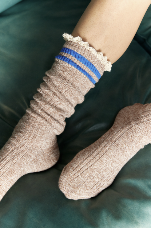 Woman wearing knee high socks in beige and blue