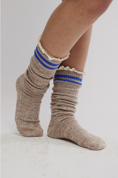 Woman wearing knee high socks in beige and blue