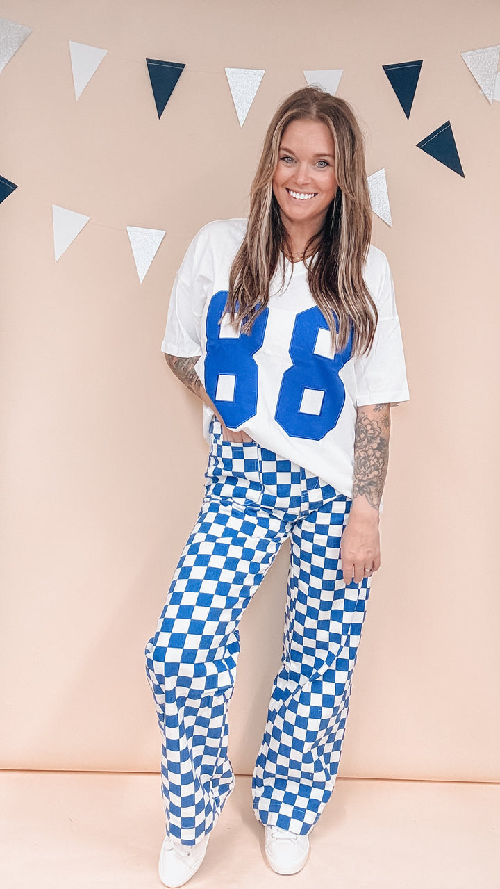 Woman wearing white tee with &