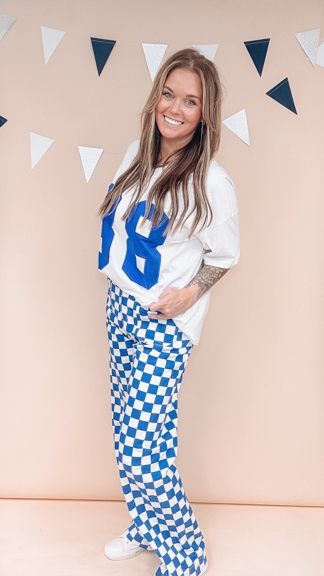Woman wearing white tee with &